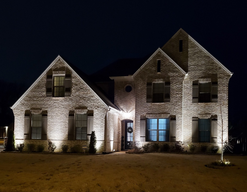Custom landscape lighting installation on residential property in Tipton County